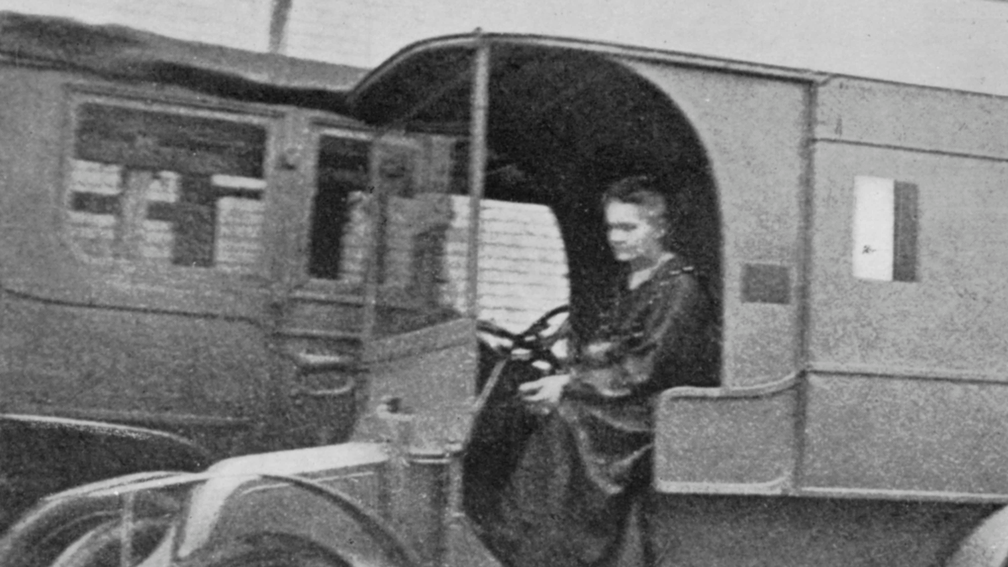 Marie Curie, Polish-born French physicist, driving a car converted into a radiological unit, 1914.