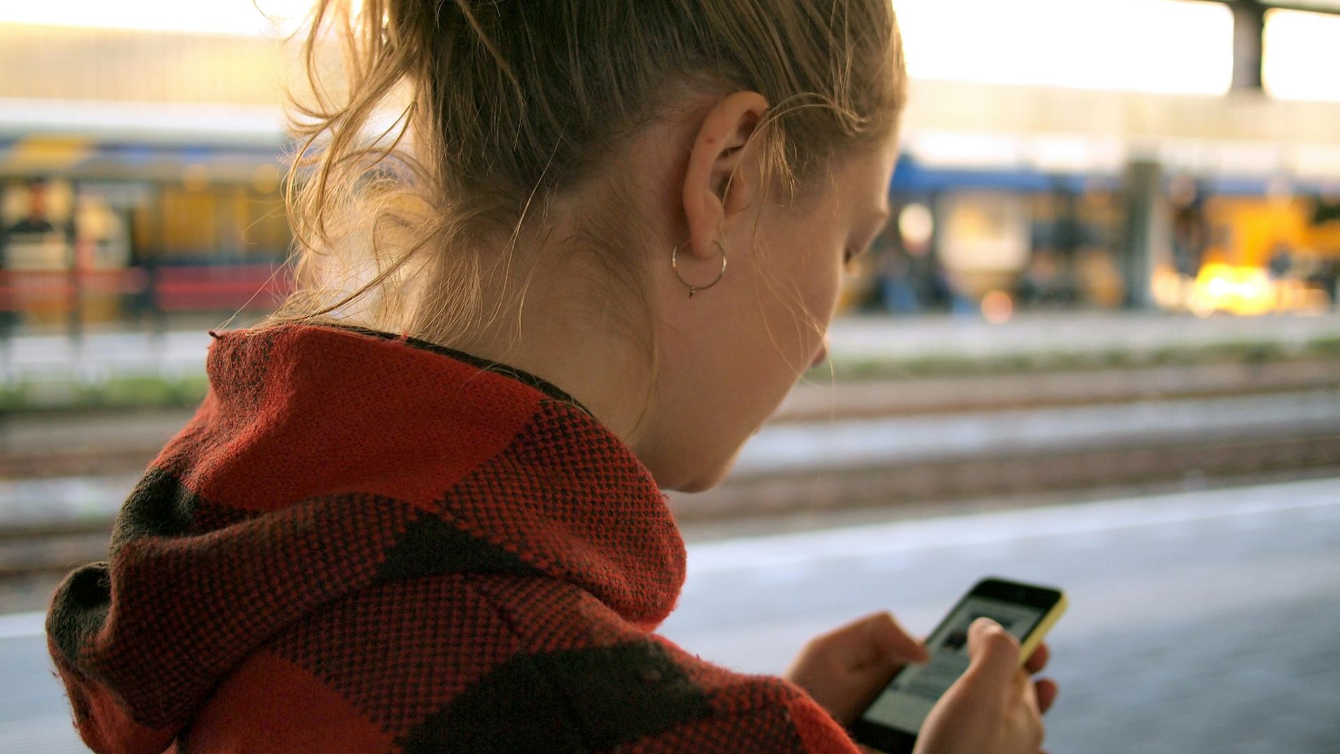 woman holding phone
