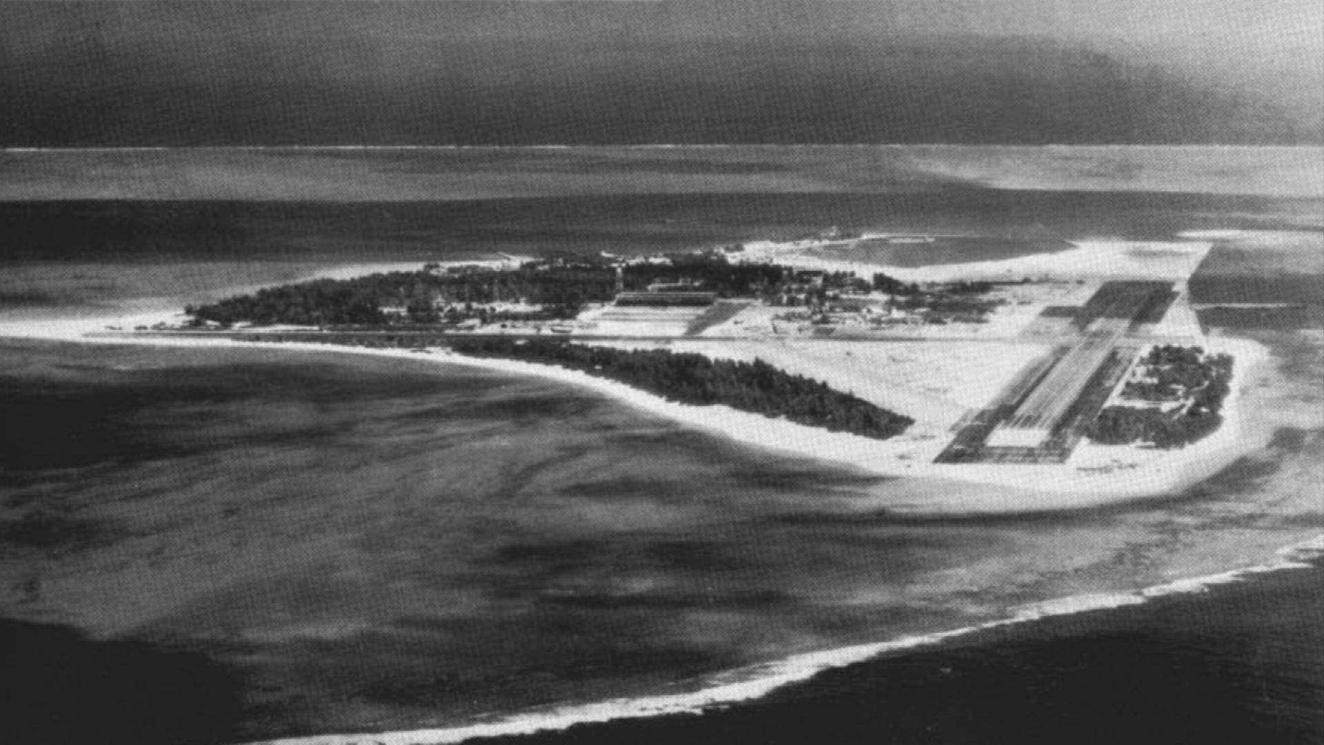 Aerial of Sand Island, with U.S. Naval Air Station Midway, at Midway Islands. At that time, Midway was one of the major bases for the Pacific Barrier airborne early warning squadrons.