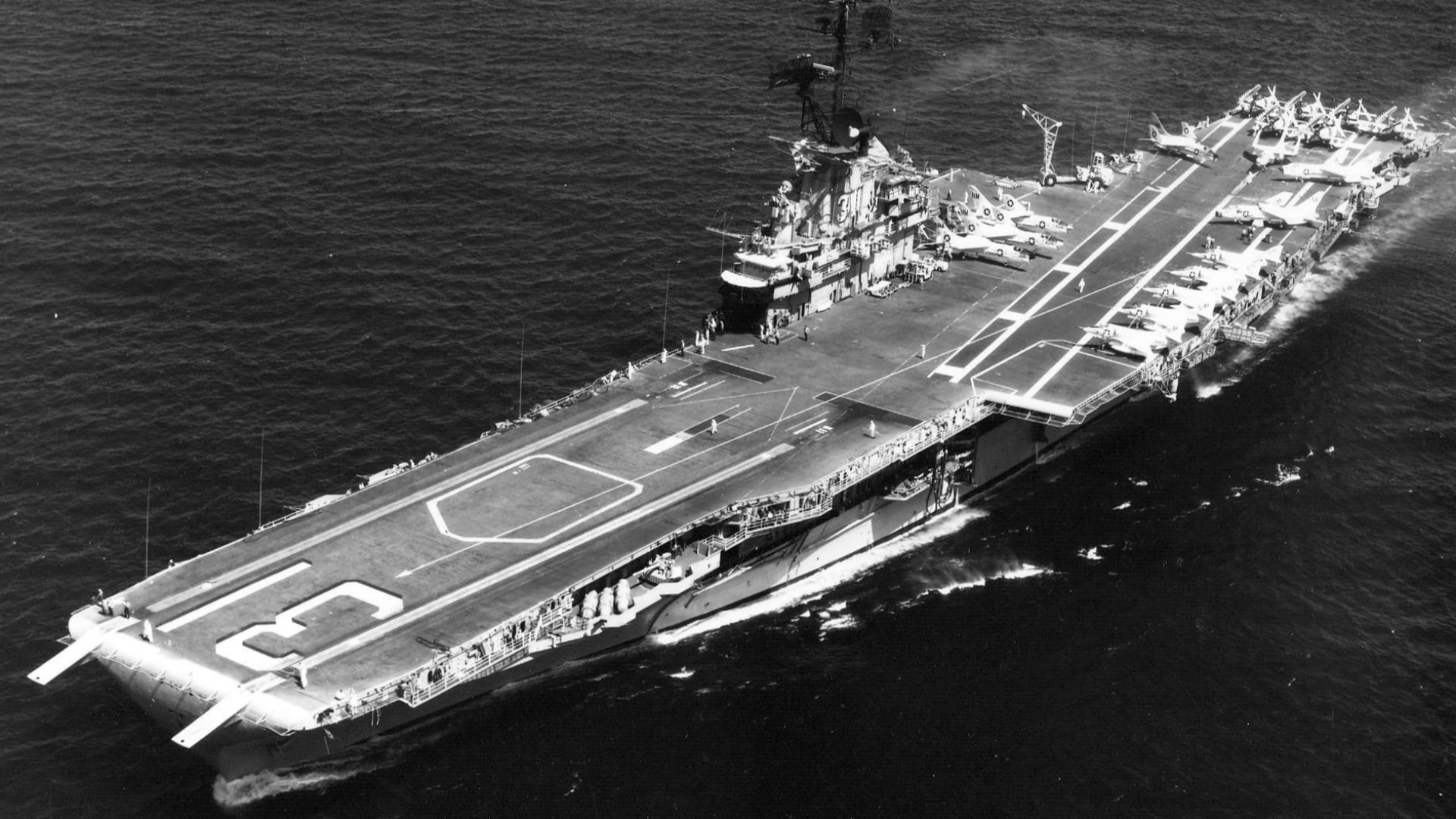 The U.S. Navy aircraft carrier USS Bon Homme Richard (CVA-31) underway. Bon Homme Richard, with assigned Attack Carrier Air Wing 19 (CVW-19), was deployed to Vietnam from 21 April 1965 to 13 January 1966.