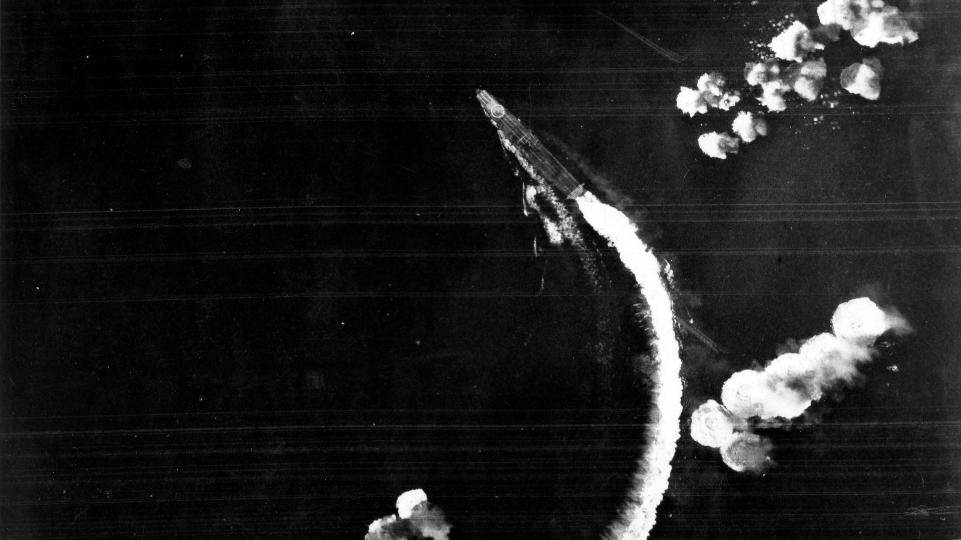 The Japanese aircraft carrier Hiryu maneuvers to avoid bombs dropped by USAAF Boeing B-17E Flying Fortress bombers during the Battle of Midway on 4 June 1942.