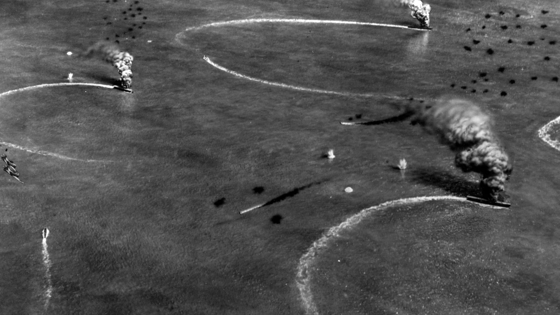 Diorama by Norman Bel Geddes, depicting the attack by USS Enterprise (CV-6) and USS Yorktown (CV-5) dive bombers on the Japanese aircraft carriers Akagi, Kaga and Soryu in the morning of 4 June 1942. 
The diorama was created during World War II on the basis of information then available. It is therefore somewhat inaccurate in scope and detail. 

This angle of view depicts Soryu (attacked by Yorktown aircraft) in the middle distance, with Kaga and Akagi (both attacked by Enterprise aircraft) as the closer two burning ships.