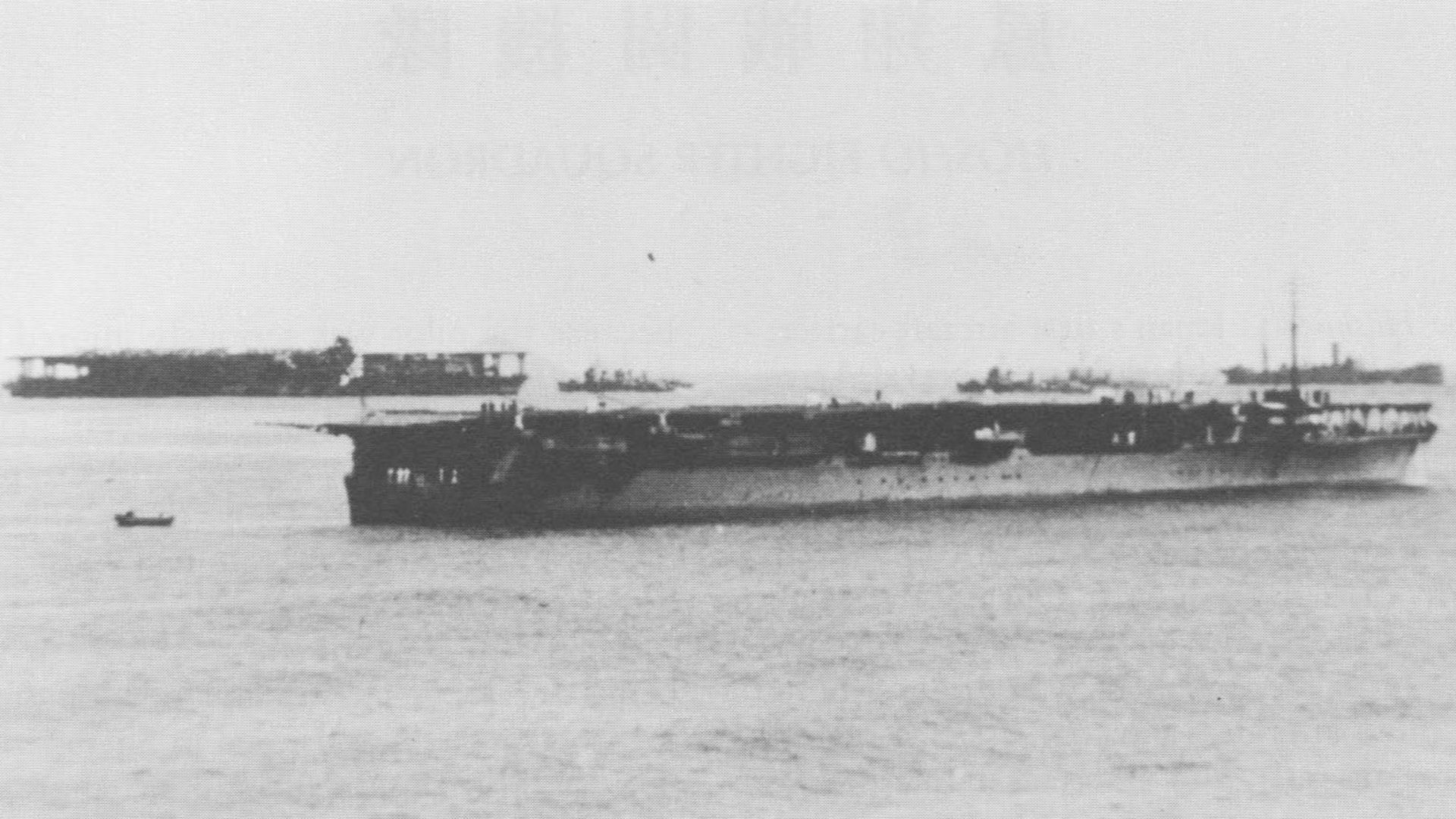 Imperial Japanese Navy aircraft carriers Hōshō (foreground) and Kaga (background) at an unknown location during the China Incident in 1937.