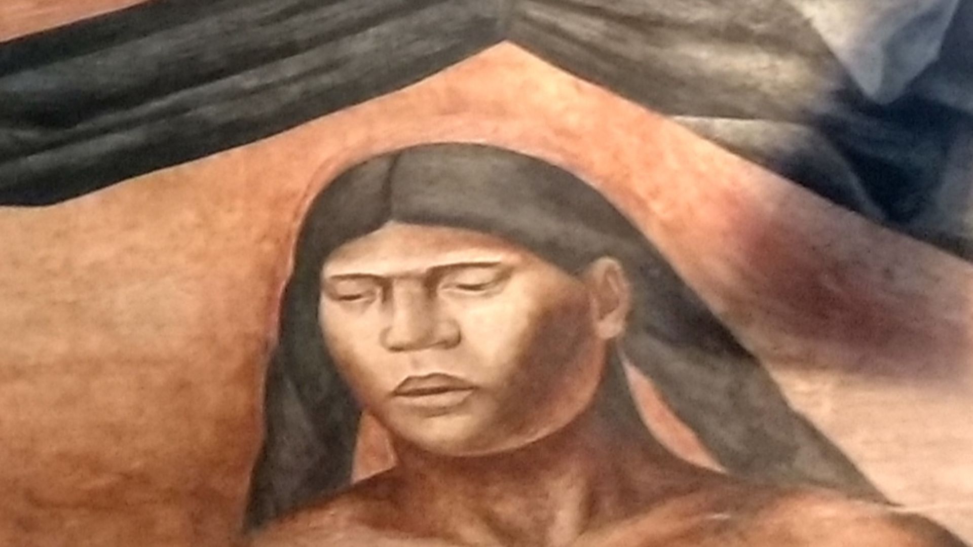 José Clemente Orozco (1883-1949)
Cortés y La Malinche,
1926
Fresco
Antiguo Colegio San Ildefonso

Sobre la raza vencida, simbolizada por una figura de tez morena a quien no se le ve el rostro, surge el mestizaje a través de la unión de los dos personajes desnudos. Cortés en actitud dominante y Malintzin con los ojos cerrados en actiud sumisa y pasiva.