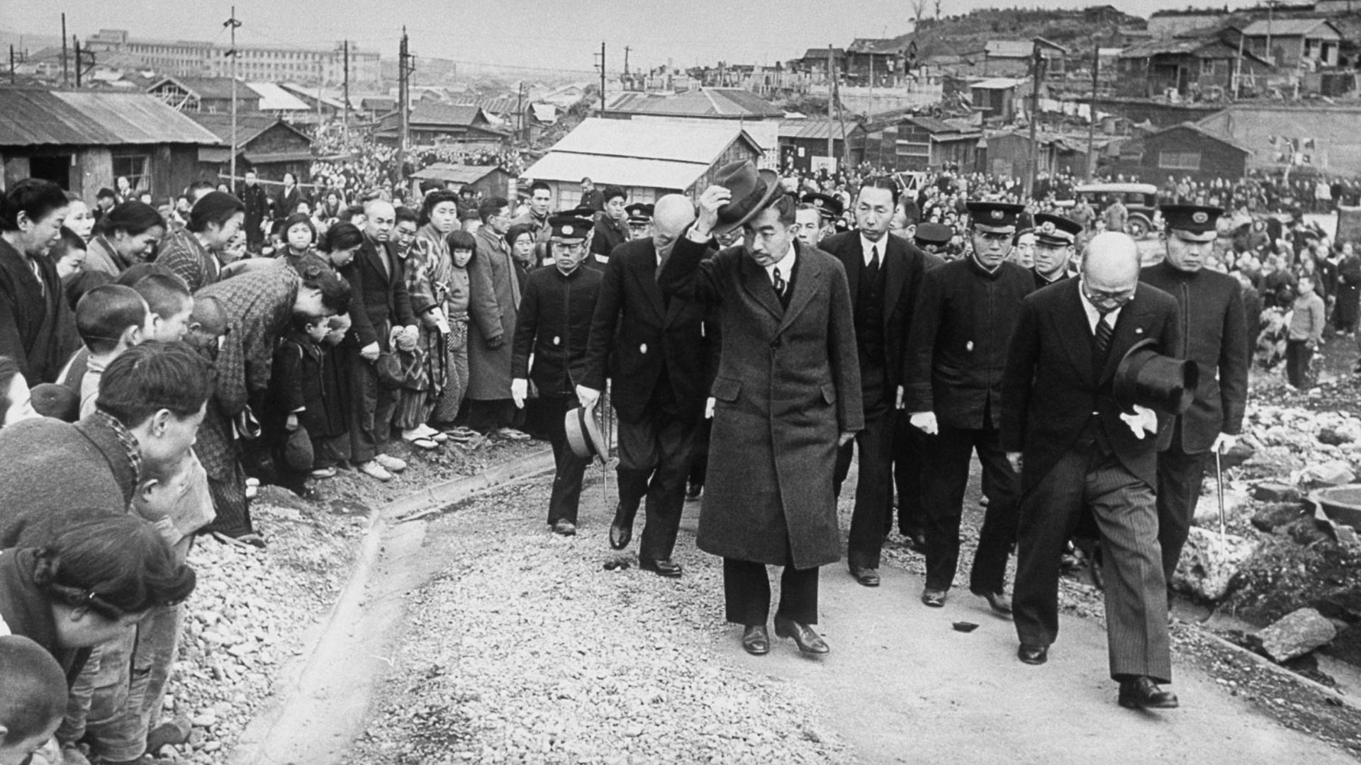 Emperor Hirohito (Showa) conducted a nationwide tour for 2 years from 1946 to 1948. The photo shows the trip to Yokohama, Kanagawa in February 1946. The emperor was in direct contact with the people, and the people who were overwhelmed by the defeat enthusiastically welcomed the emperor. The Emperor traveled 20,500 miles (33,000 km) to see the living conditions in the country, support the public since the end of the war and to inspire them to rebuild the devastated country.