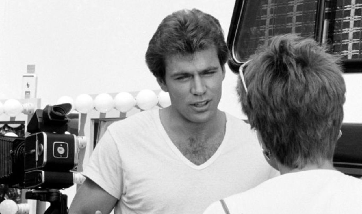 Jon-Erik Hexum and guest prepare for filming during production of 