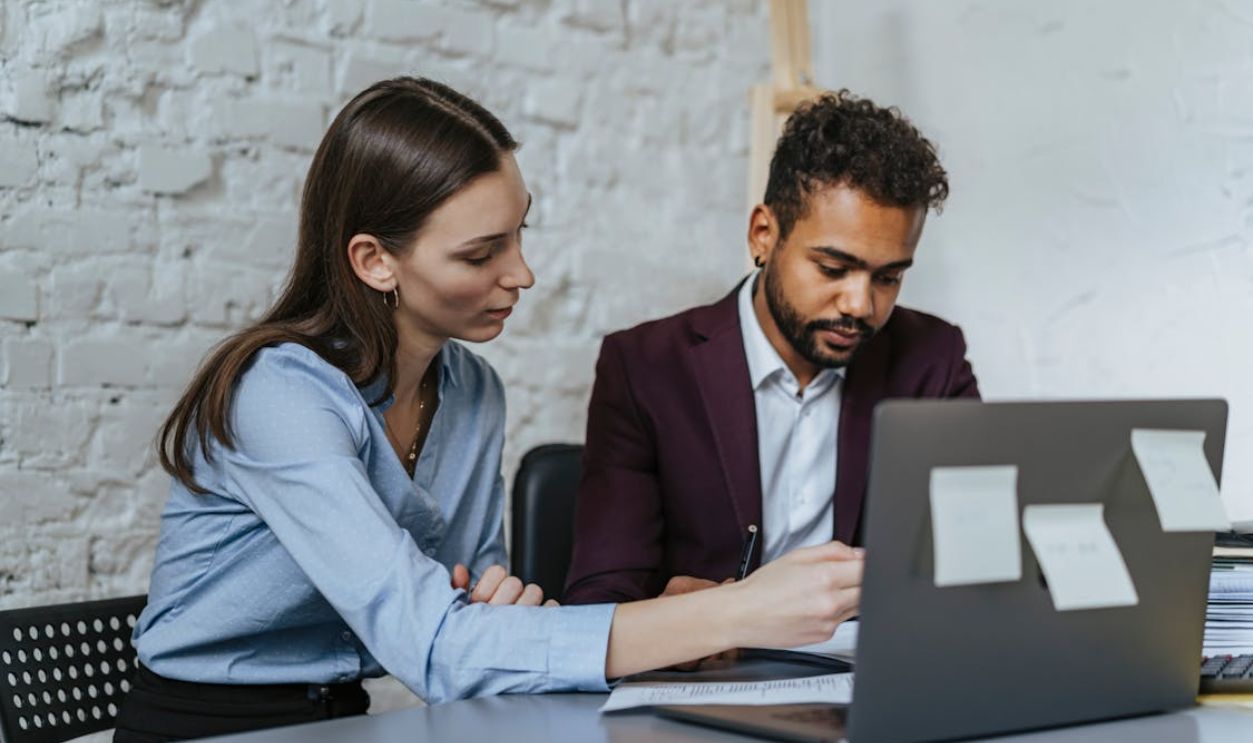 Focused business professionals collaborating in a modern office environment.