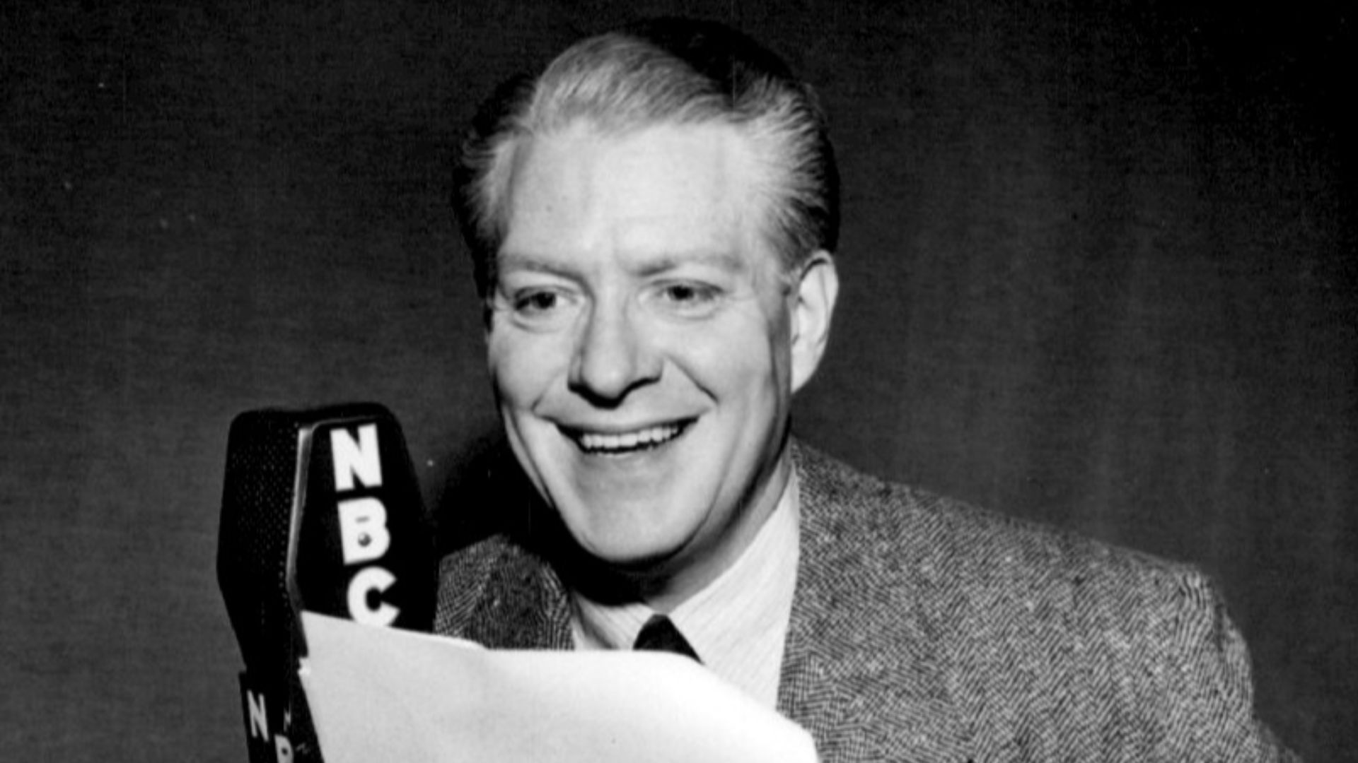 Photo of Nelson Eddy from the radio version of Kraft Music Hall.  Eddy was hosting the program while its regular host, Al Jolson, was on vacation. People in the radio industry had the summer off, just as television programs do now.  Instead of reruns prominent in the television industry, radio shows either went on summer vacation with summer replacement shows or had replacement hosts during this time period.