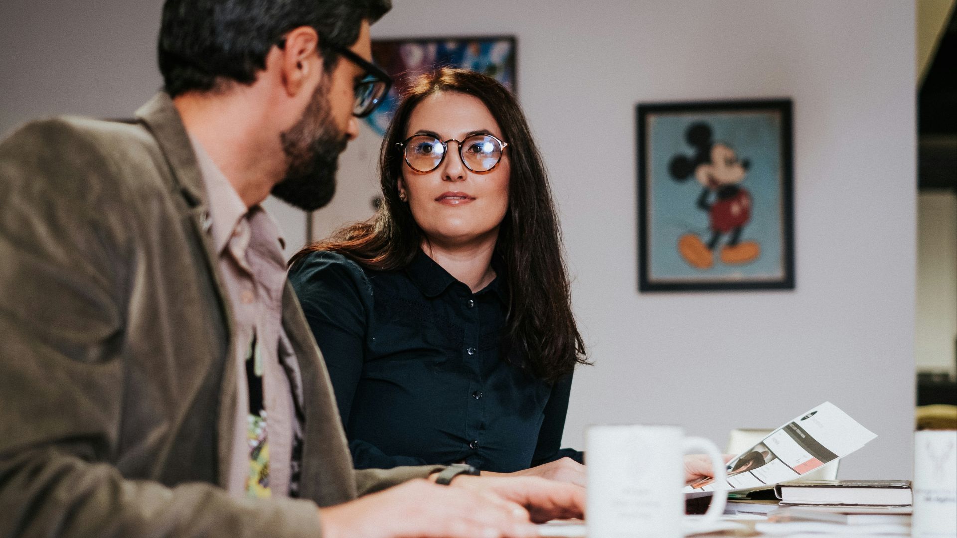 man and woman sitting at table