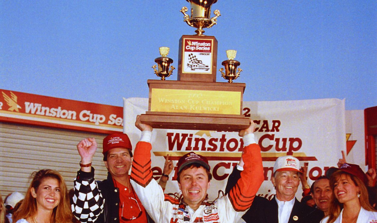 Gettyimages - 77892268, Alan Kulwicki Poses with the Winston Cup Championship Trophy 