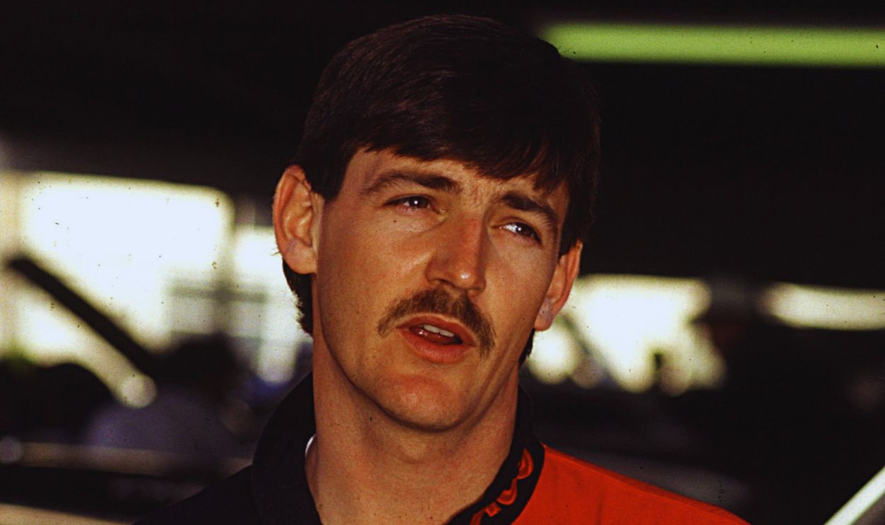Gettyimages  - 81604893, 1991: Davey Allison stands in the garage before Ricky Rudd wins the race at Infineon in 1991, but the victory is taken away after NASCAR charges Rudd with roughing up Allison with one lap to go. 