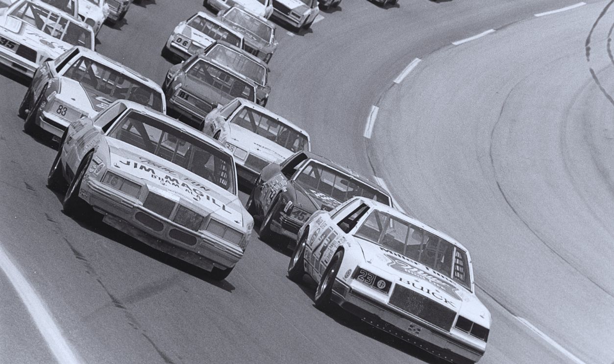 Gettyimages - 151000007, ARCA Start - Talladega 1984 TALLADEGA, AL — July 28, 1984: Davey Allison (No. 23) starts from the pole as the field gets ready for the start of the Talladega ARCA 200 at Talladega Superspeedway. K. C. Spurlock (No. 18) is on the outside pole, with Jeff (No. 45) and Bob Dotter (No. 83) making up row two. 