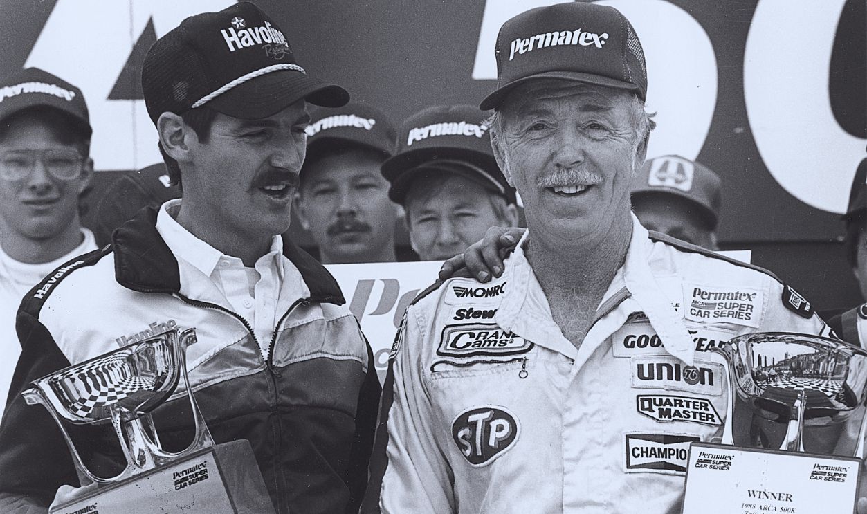 Gettyimages - 143049243, Red Farmer - Talladega ARCA VL 1988 TALLADEGA, AL — April 30, 1988: Red Farmer (R) celebrates in victory lane at Talladega Superspeedway with his car owner Davey Allison (L) after Farmer won the ARCA Permatex 500K.
