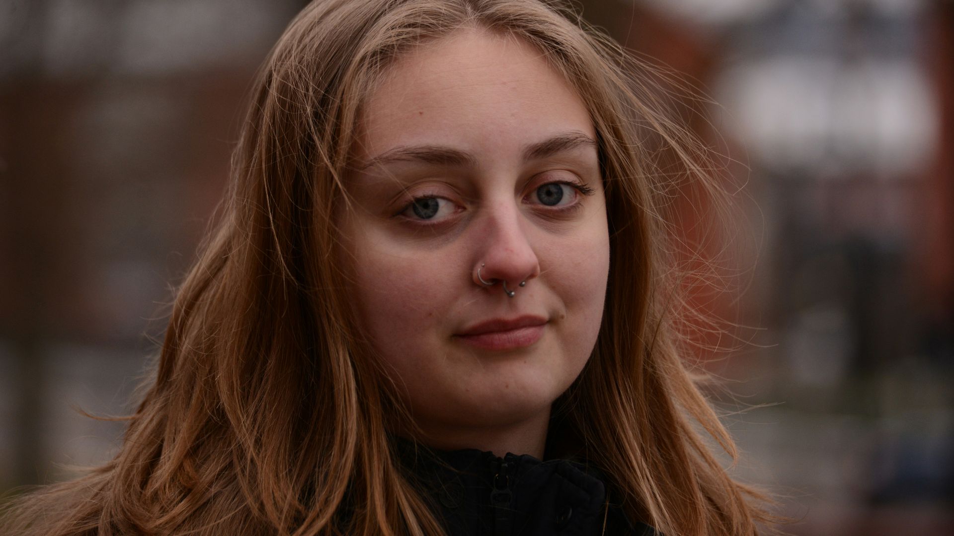 Young woman with long blonde hair outdoors