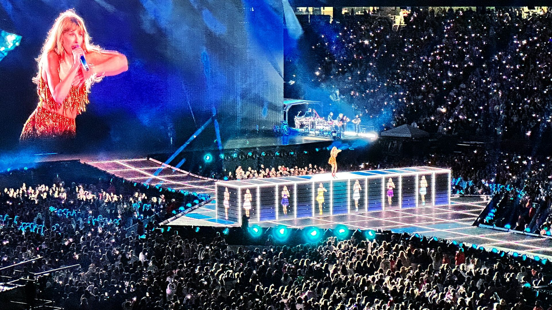 a crowd of people watching a woman on a stage