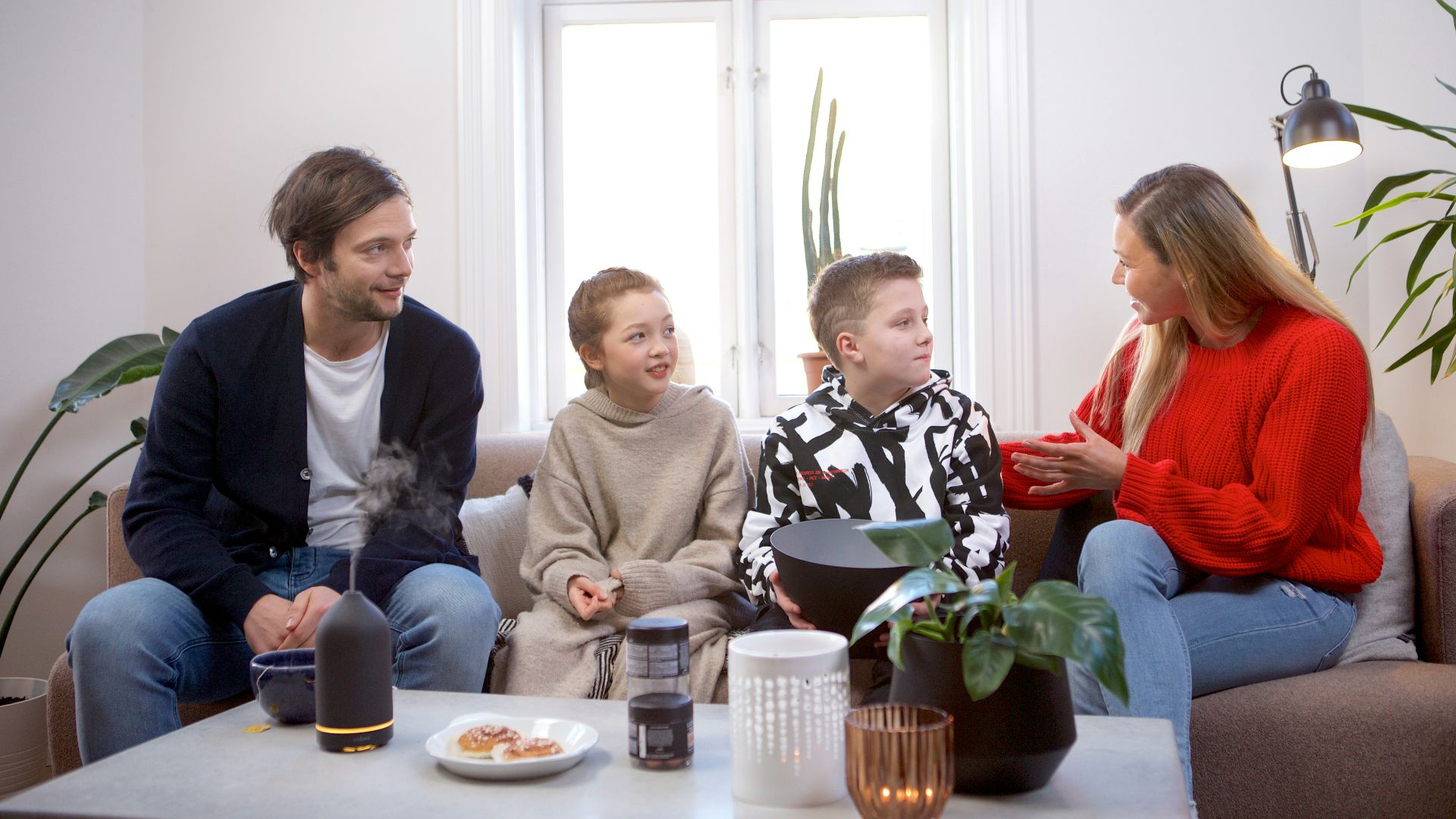 a group of people sitting on top of a couch