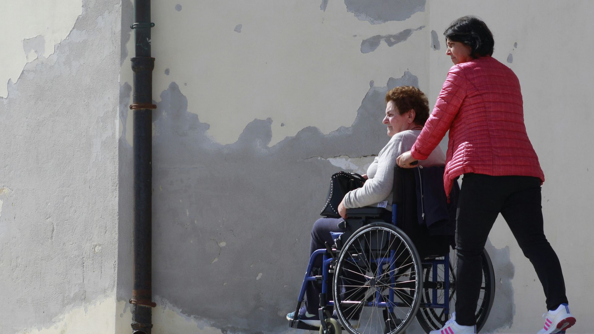 woman sitting on gray wheelchair