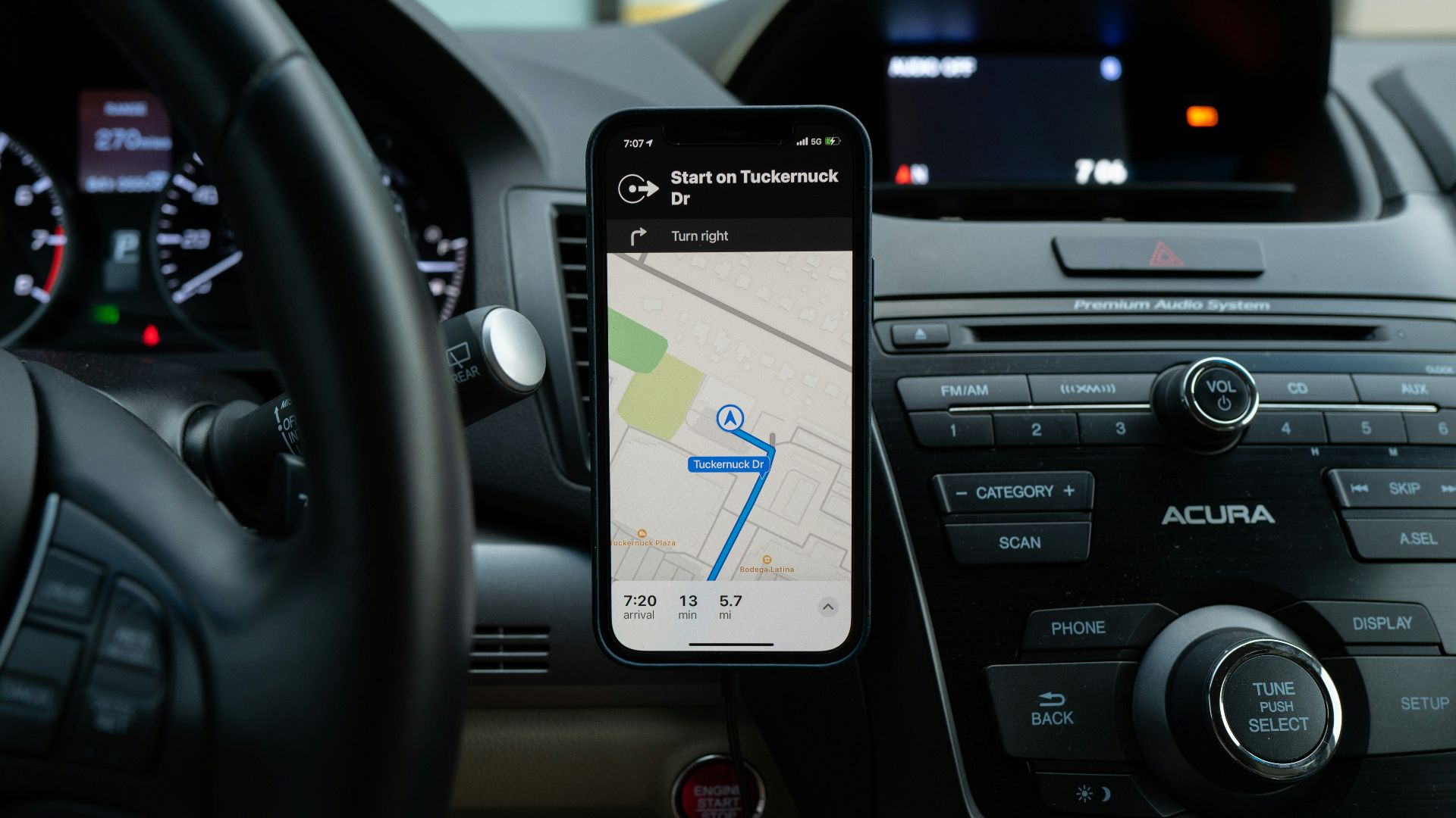 black android smartphone on car center console