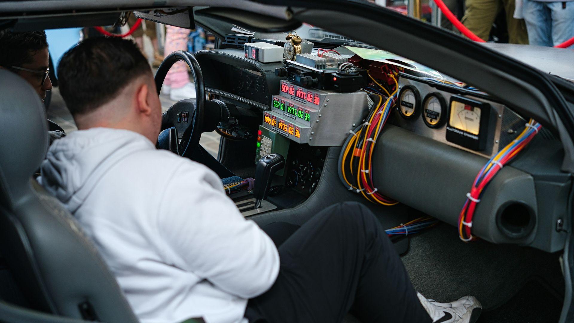 A man sitting in the driver's seat of a car