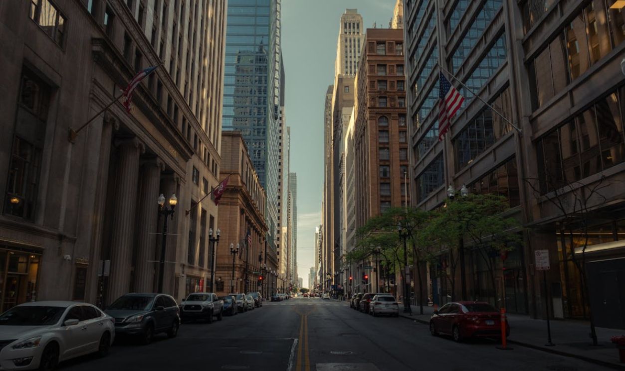 An impressive street vista showcasing Chicago's iconic skyscrapers and city life under daylight