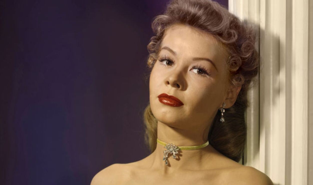American dancer and actress Vera-Ellen portrait in an off-the-shoulder green dress, circa 1947.