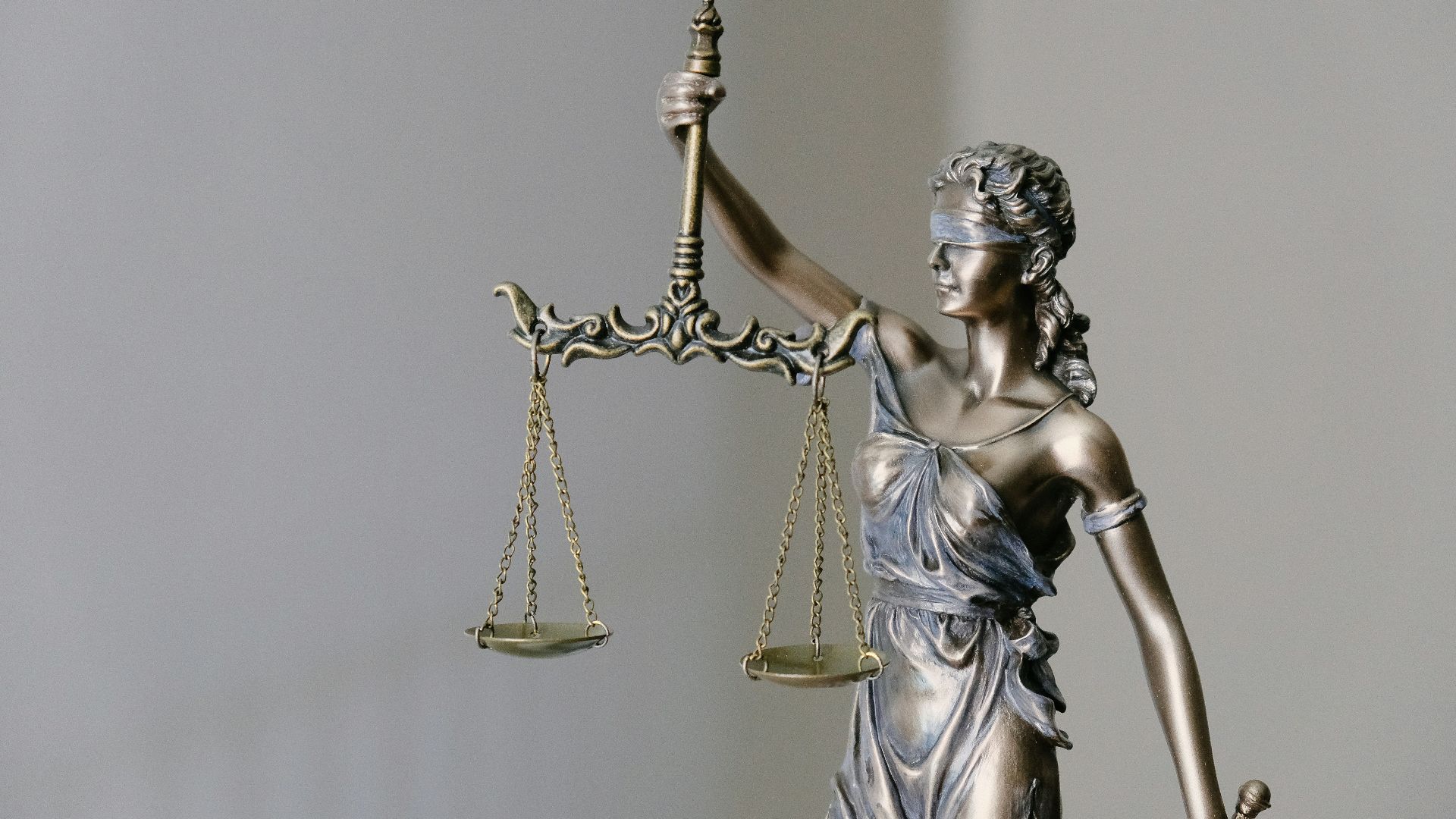 lady justice statue with scales and sword