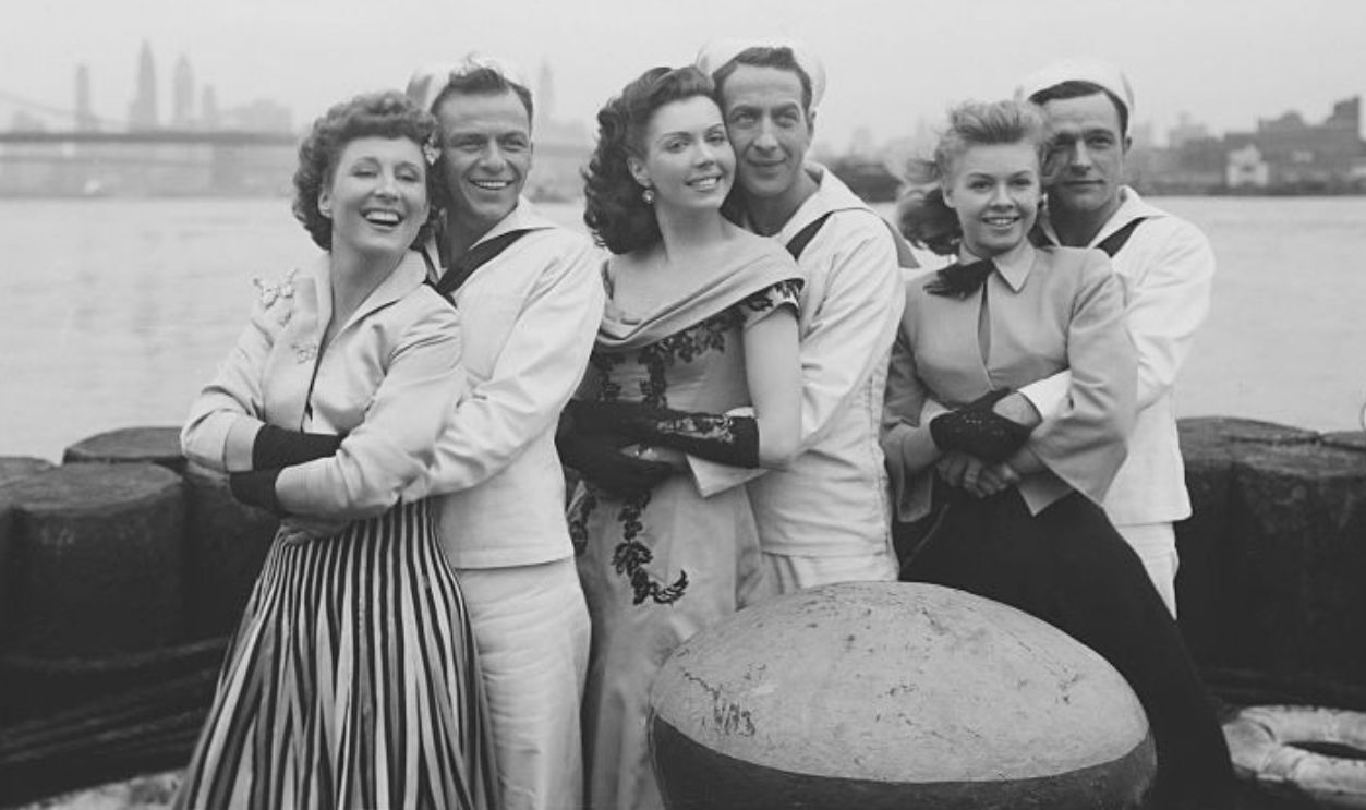 From left: Betty Garrett, Frank Sinatra, Ann Miller, Jules Munshin, Vera-Ellen, and Gene Kelly together in New York in On the Town. 