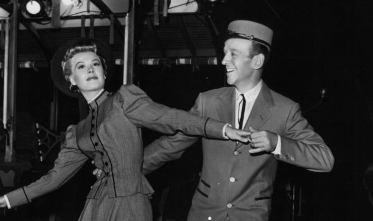 Vera-Ellen and Fred Astaire dancing near trolly in a scene from the film 'The Belle Of New York', 1952.