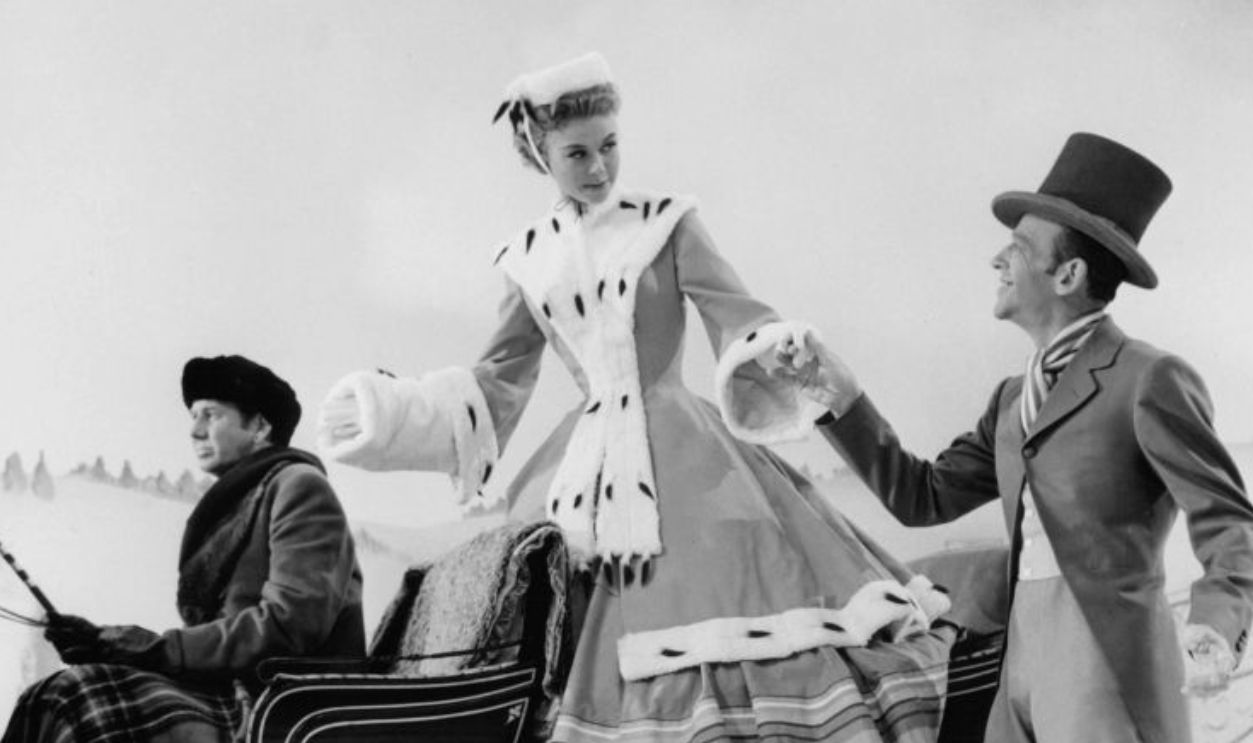 Vera-Ellen is helped out of a carriage by Fred Astaire in a scene from the film 'The Belle Of New York', 1952.