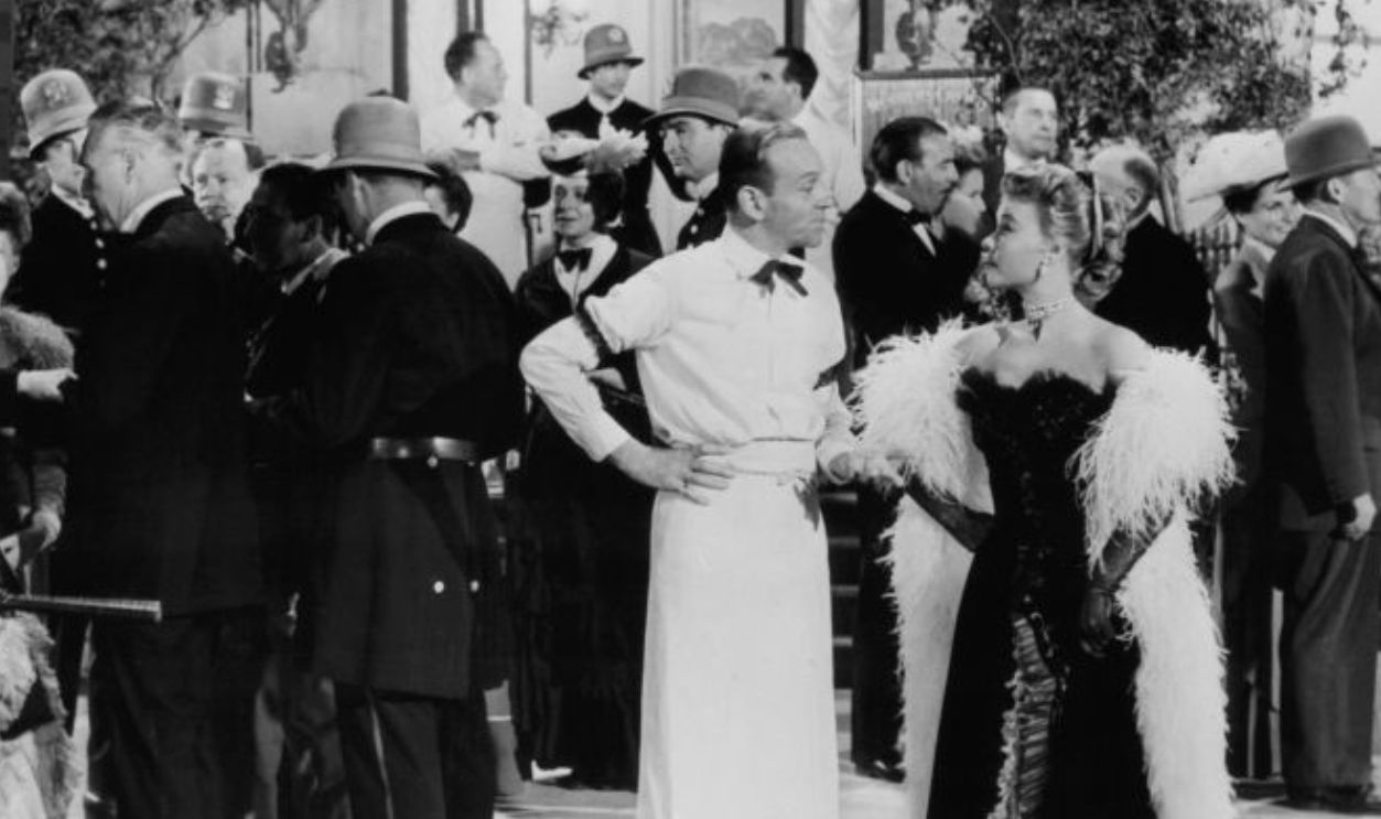 Fred Astaire meeting with Vera-Ellen outside casino in a scene from the film 'The Belle Of New York', 1952. 