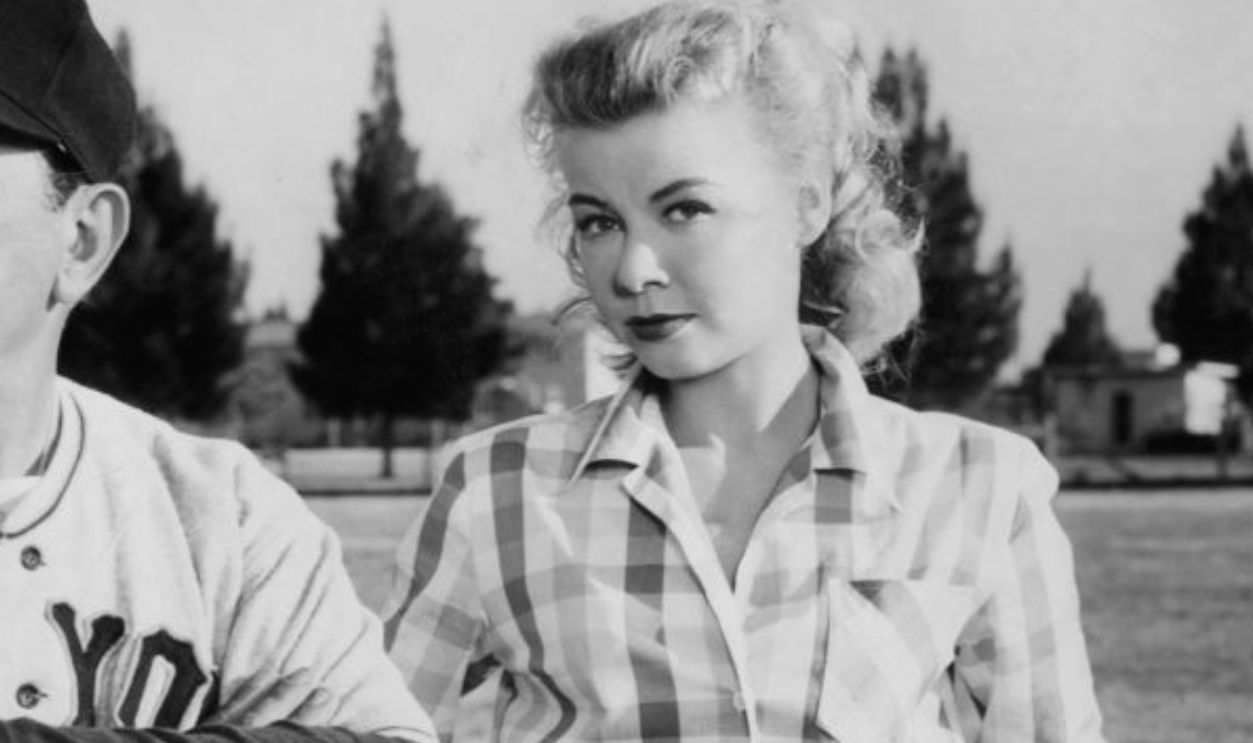 Edward G Robinson folds his arms next to Vera-Ellen in a scene from the film 'Big Leaguer', 1953.