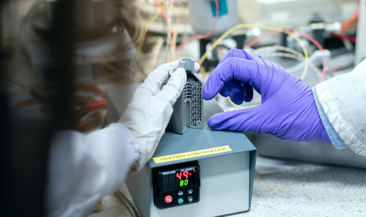 Scientist testing materials in a laboratory setting for clean energy solutions.