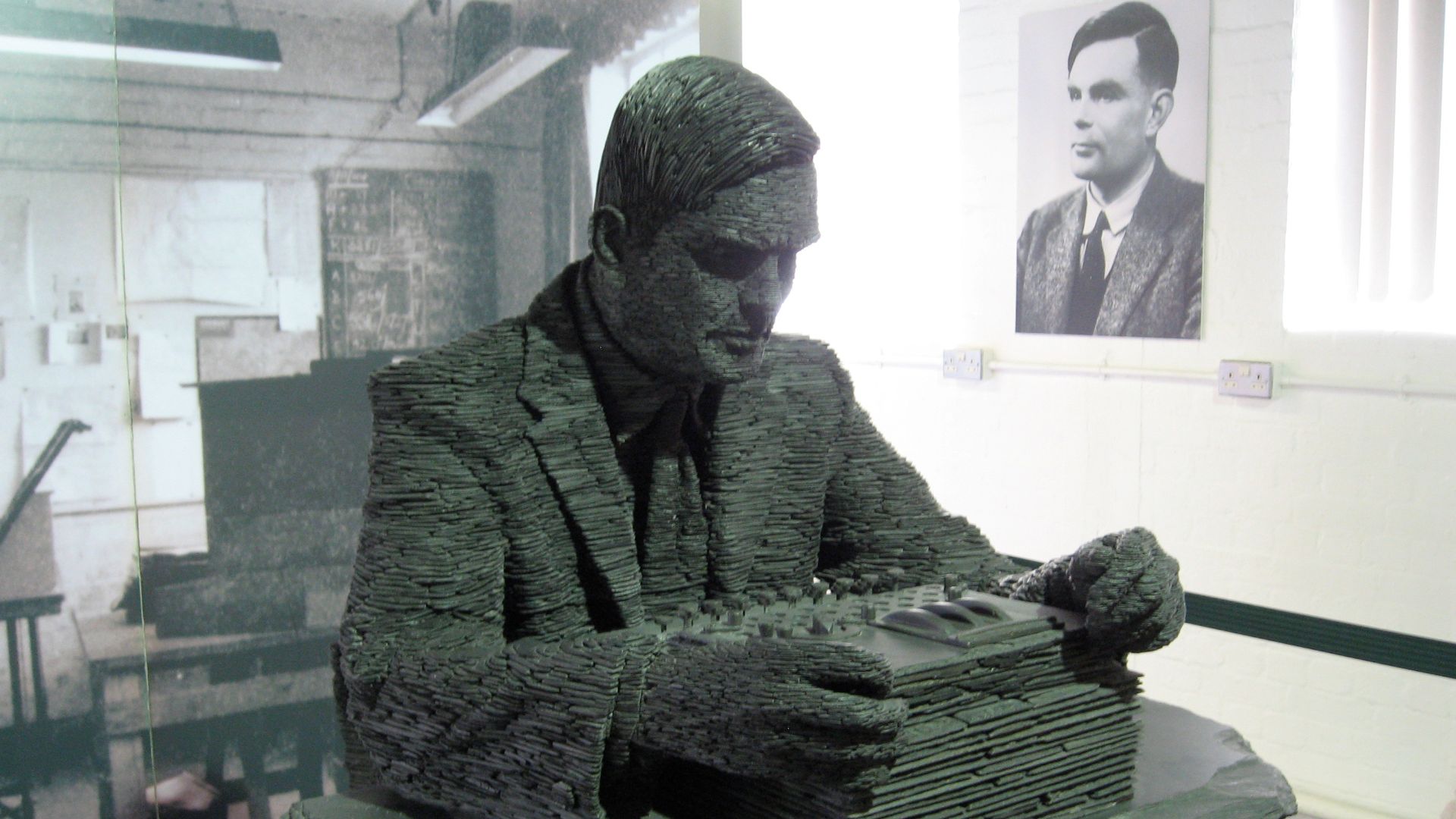 The 1.5 -ton statue of Alan Turing, by Stephen Kettle commissioned by the American billionaire Sidney Frank. This statue at Bletchley Park is made of about half a million pieces of slate quarried in Wales. People who knew him say this takes their breath a