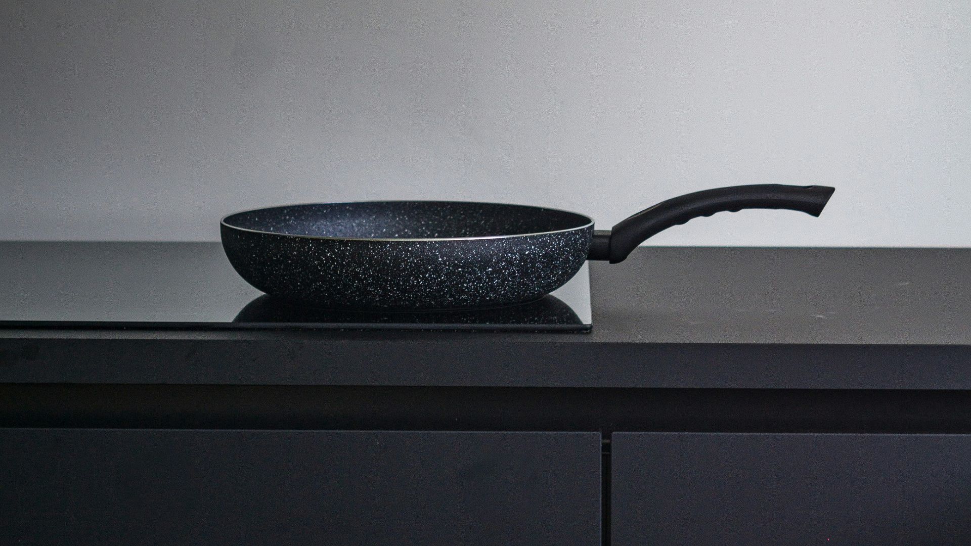 black ceramic bowl on white table