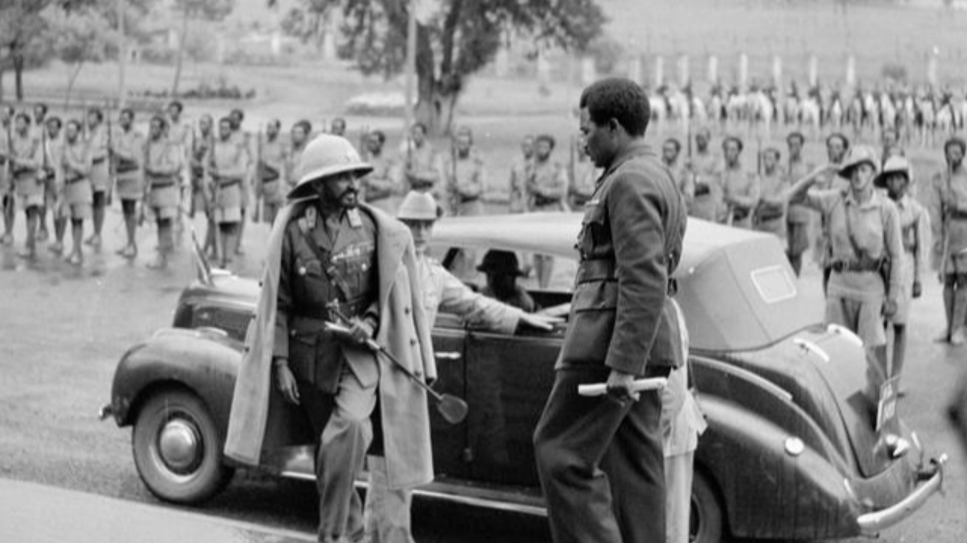 Haille Salassie Enters Addis Addis
After five years to the day, a beflagged and decorated Addis Ababa turned out to watch their Emperor, Haille Selassie return in triumph to the capital of his liberated country. This image shows the Emperor mounting the s