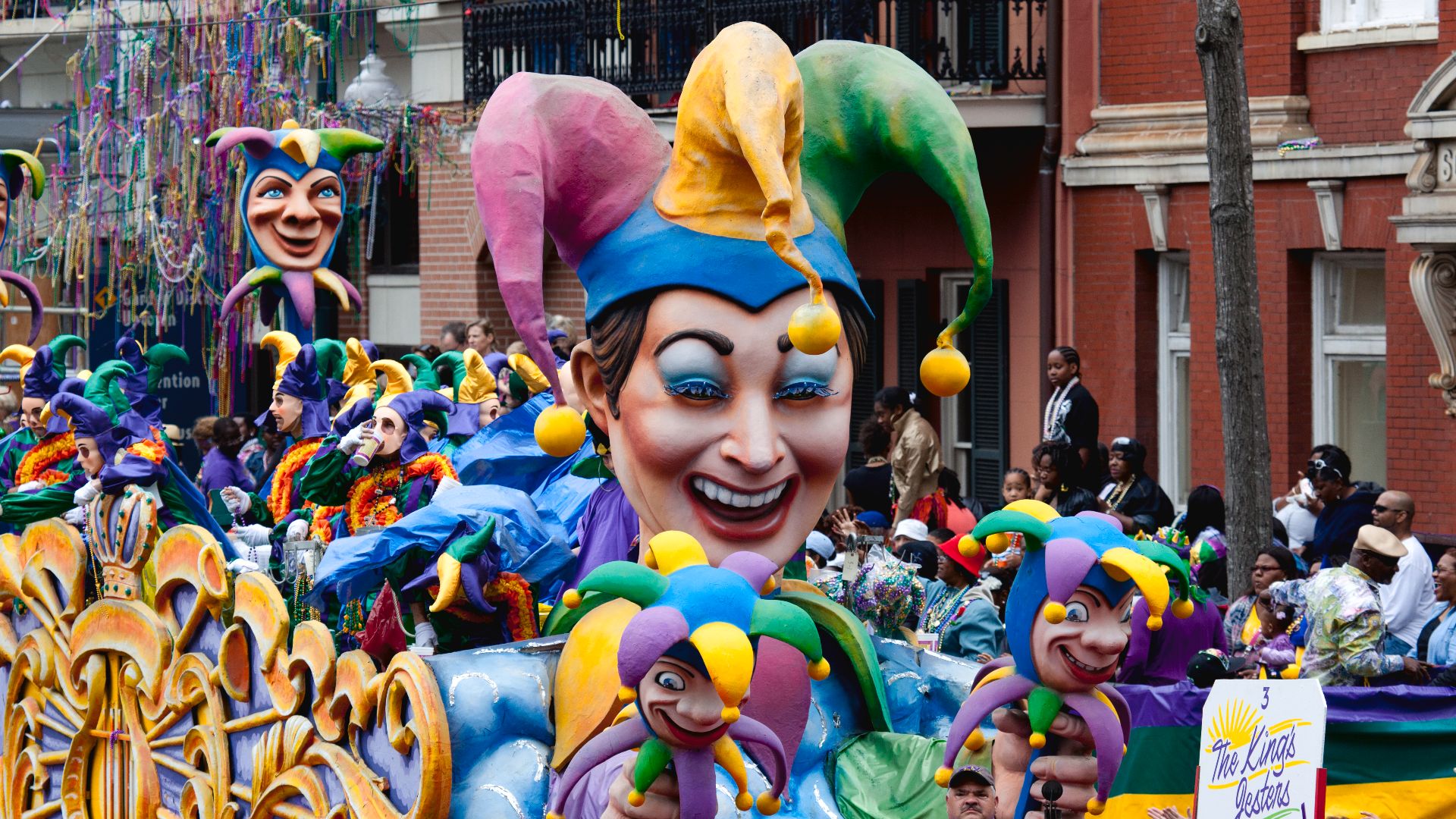 Mardi Gras Parade, New Orleans, Louisiana, 2011 March 8. 1 photograph : digital, TIFF file, color. Mardi Gras is organized by Carnival krewes. Krewe float riders toss throws to the crowds; the most common are strings of plastic colorful beads, doubloons, 