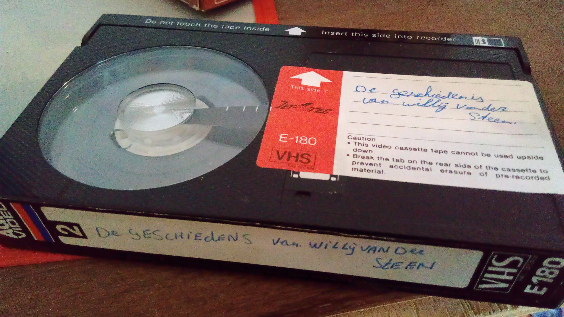 A Betamax-format videocassette with labels intended for VHS tapes stuck on. (The fact this is Betamax and not VHS can be seen via the distinctive