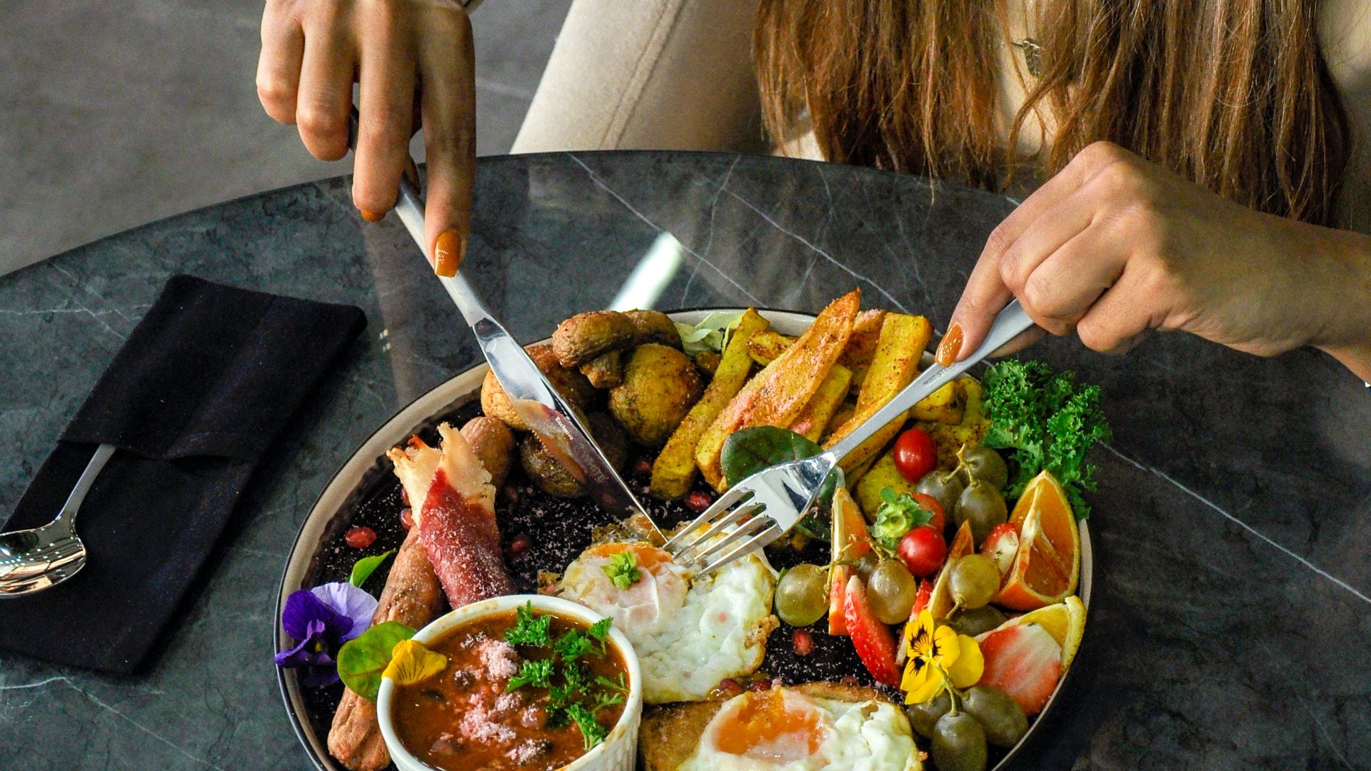 a person holding a plate of food