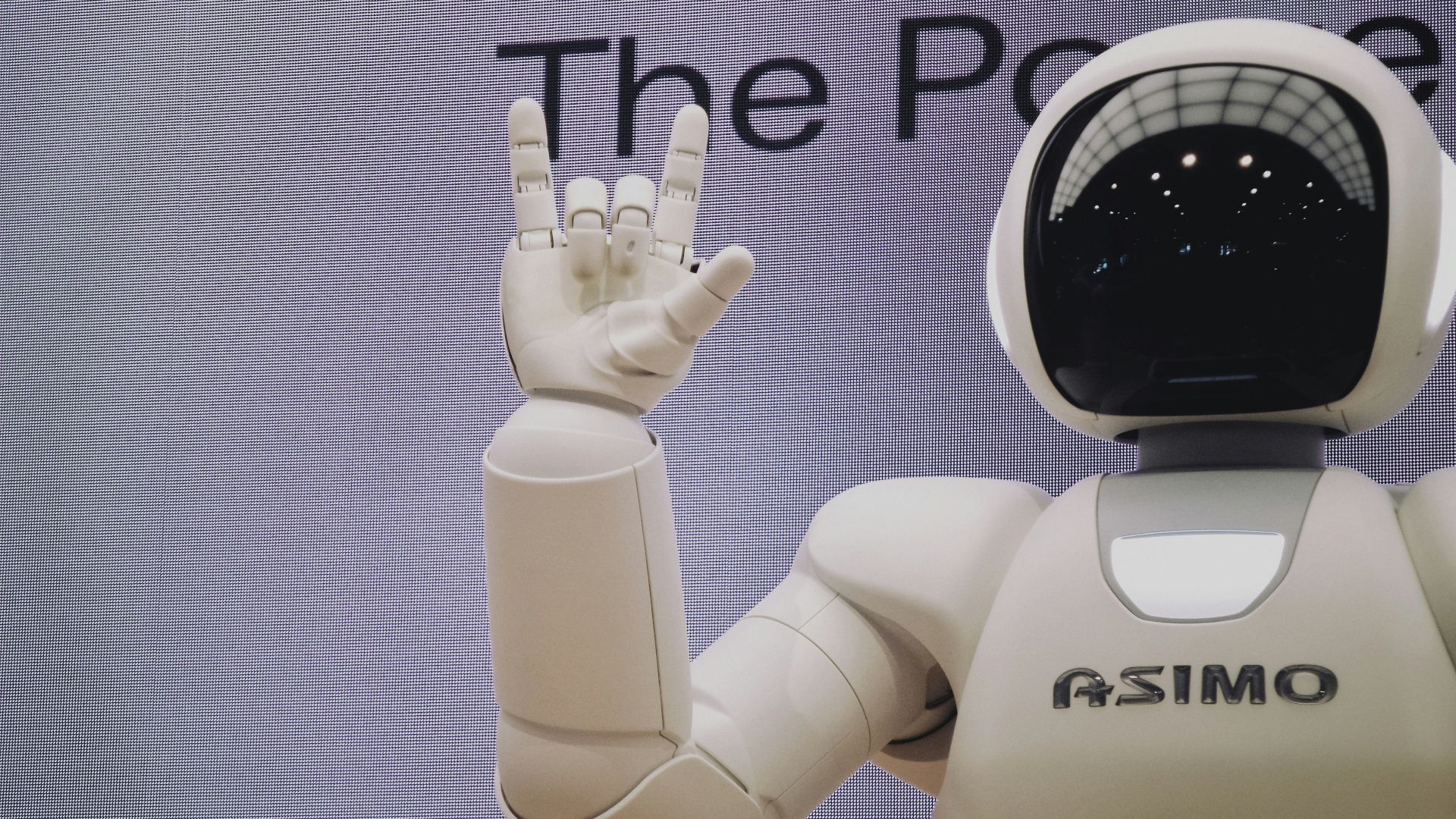 Asimo robot doing handsign