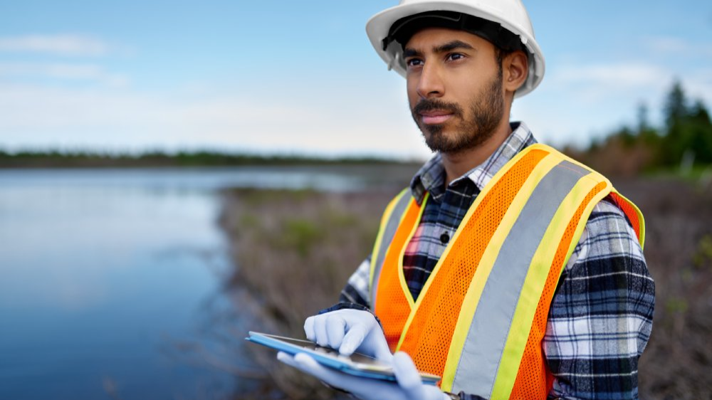 Portrait Photo of Marine biologist analyzing water test results on a tablet