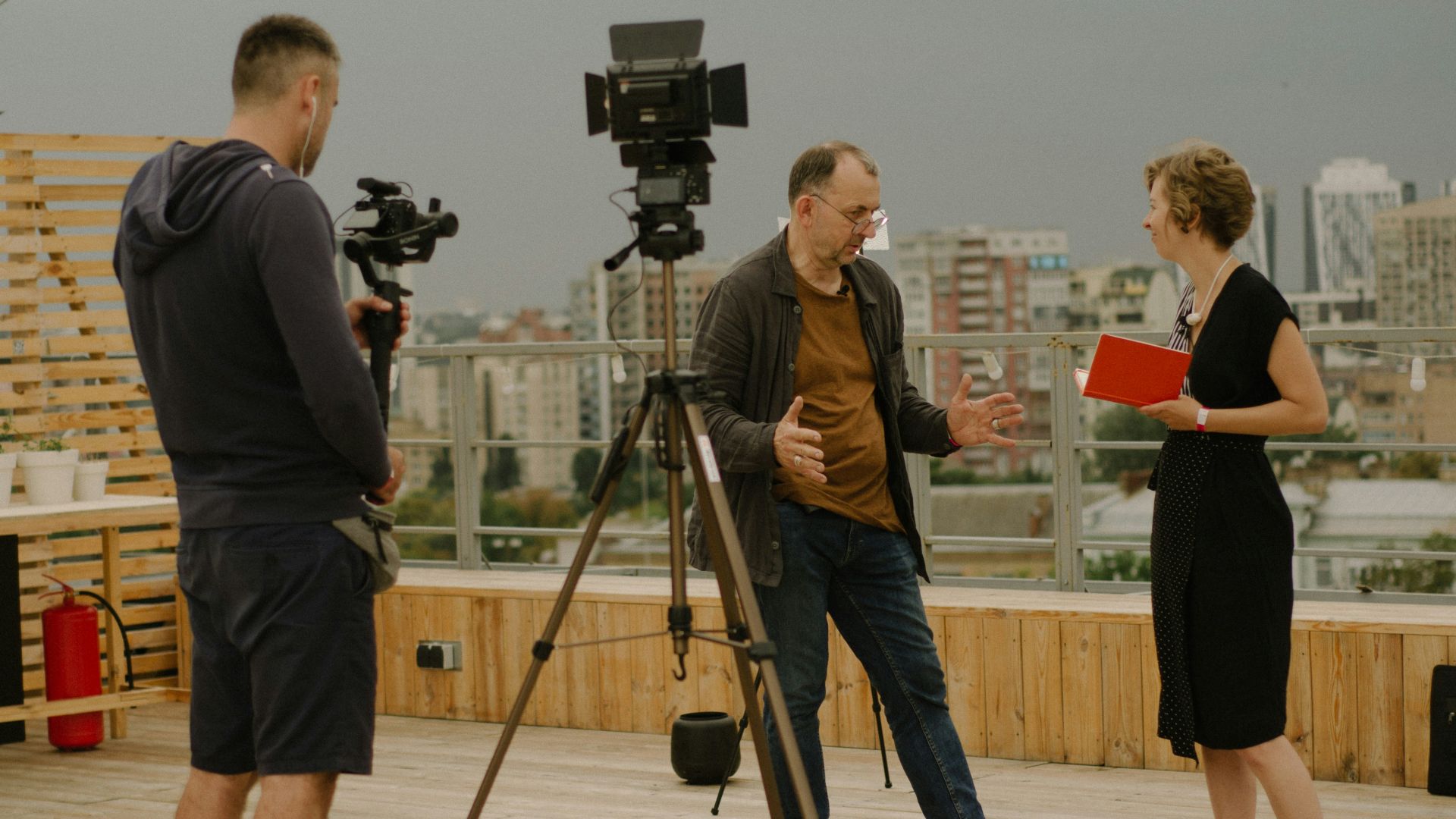 a group of people standing on top of a wooden floor
