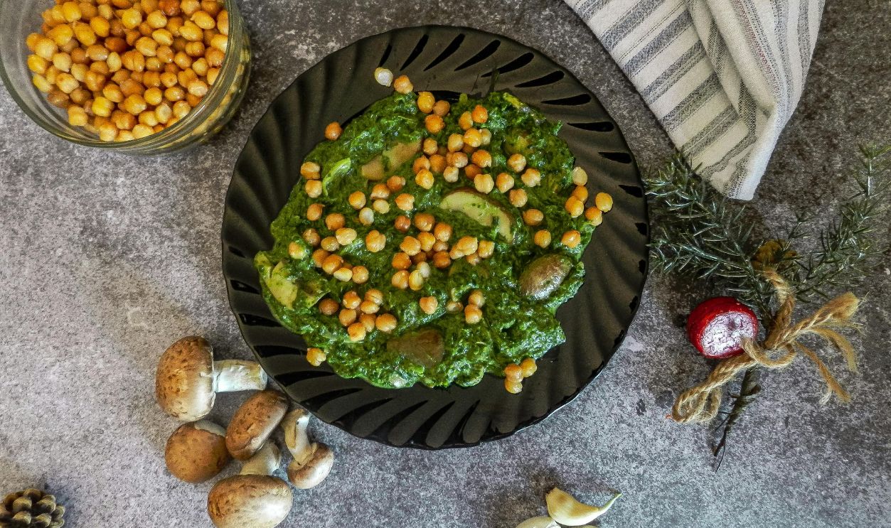 Delicious chickpea and spinach meal with mushrooms on a plate, perfect for healthy dining