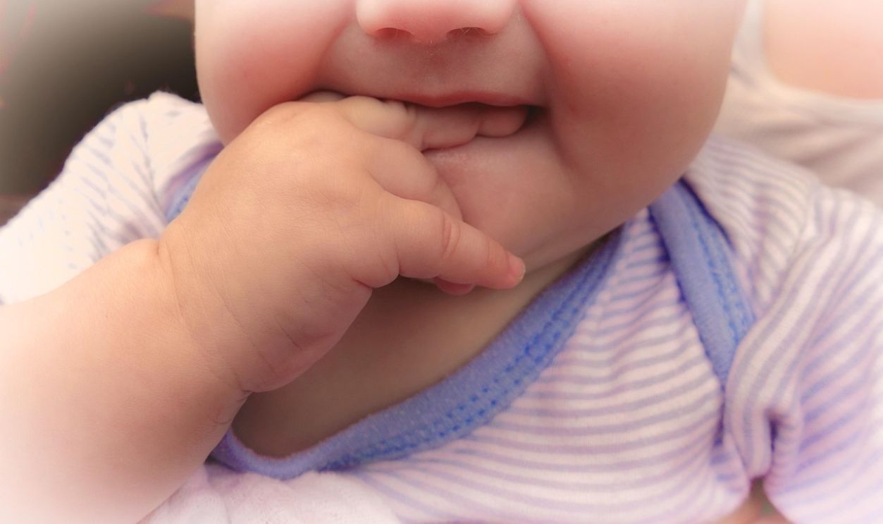 infant finger mouth cute child