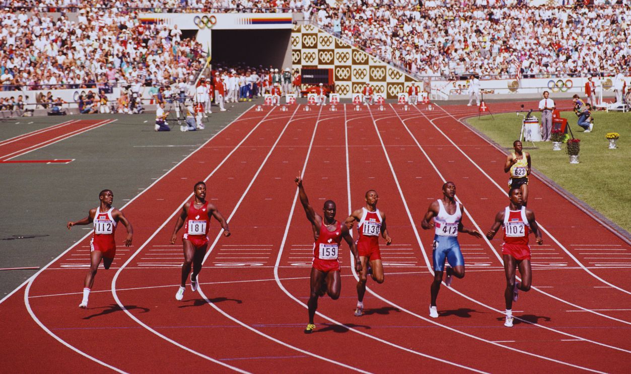 Gettyimages - 686677387, XXIV Olympic Summer Games Left - right Dennis Mitchell and Desai Williams look across at Ben Johnson of Canada who holds his arm aloft in victory over Calvin Smith of the USA, Linford Christie of Great Britain and Carl Lewis of the USA at the finish of the Men's 100 Metres final race at the XXIV Summer Olympic Games on 24 September 1988 at the Seoul Olympic Stadium in Seoul, South Korea. 