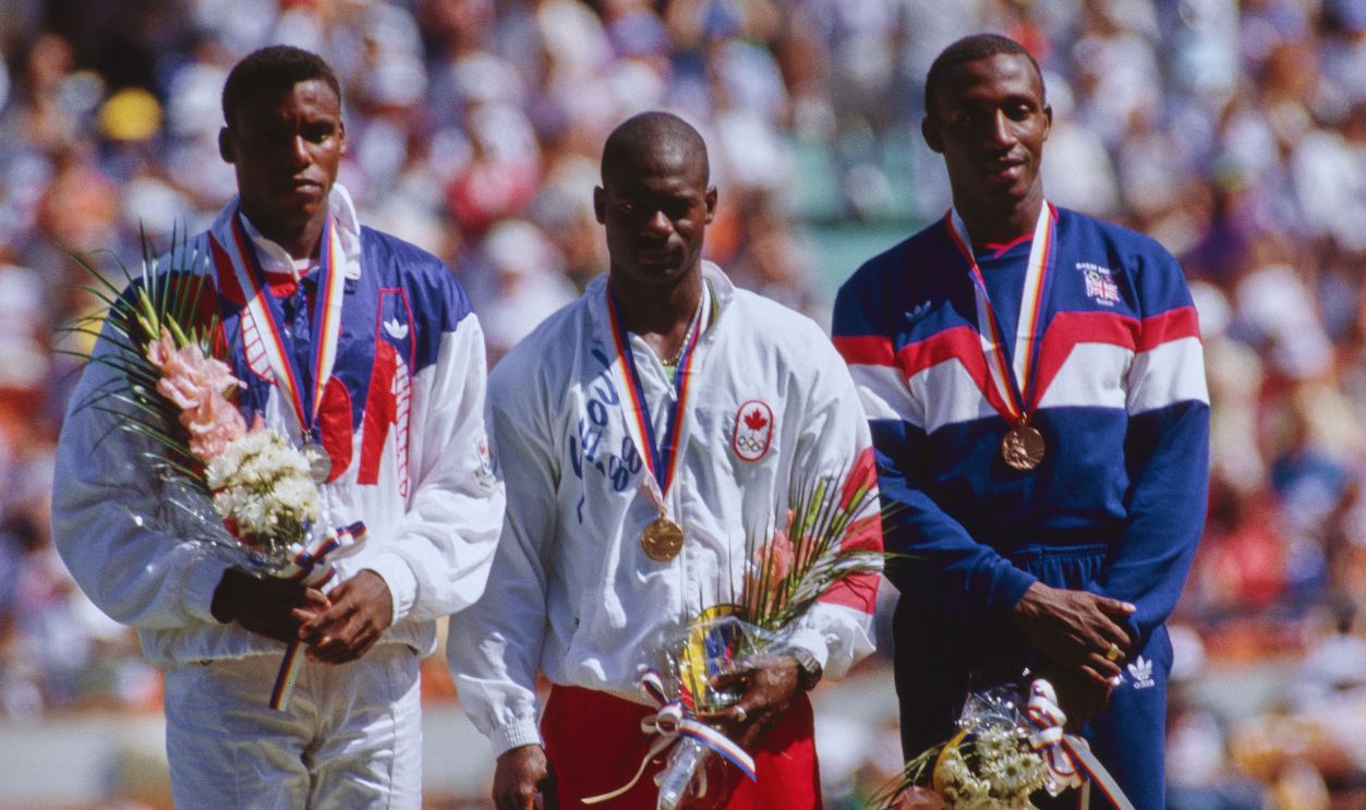 Gettyimages - 2148946480, 1988 Summer Olympics - Men's 100m - Medal Ceremony American athlete Carl Lewis, Jamaican-born Canadian athlete Ben Johnson, and Jamaican-born British athlete Linford Christie during the medal ceremony following the men's 100m event of the 1988 Summer Olympics, at the Seoul Olympic Stadium in Seoul, South Korea, 24th September 1988. 