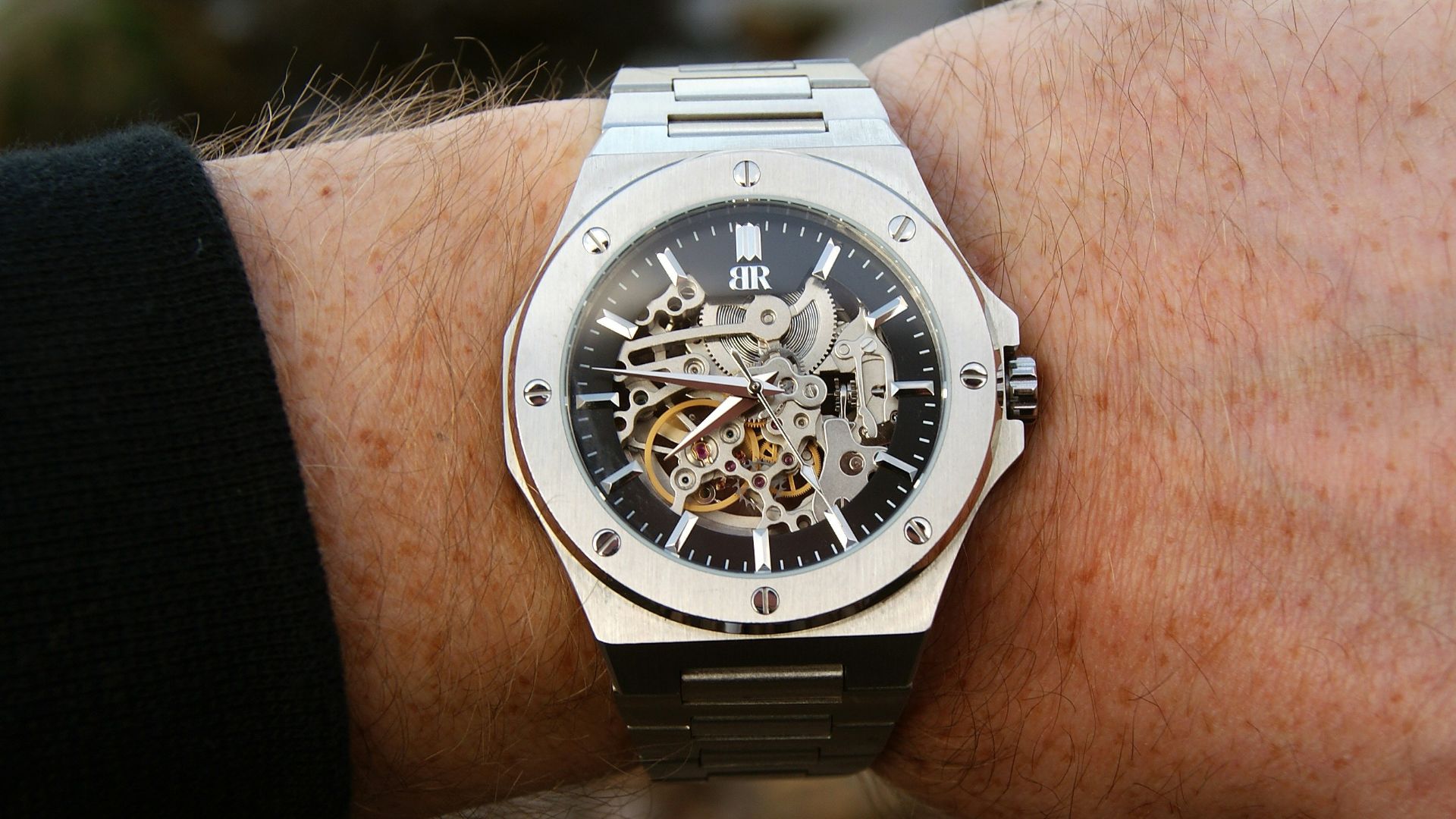 a man's wrist with a watch on it