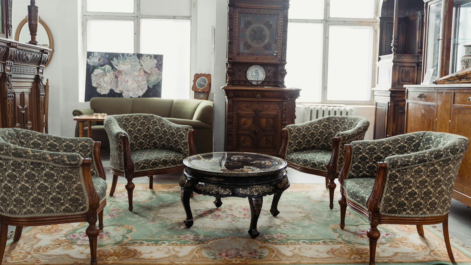 A charming vintage room featuring elegant antique furniture and decor.