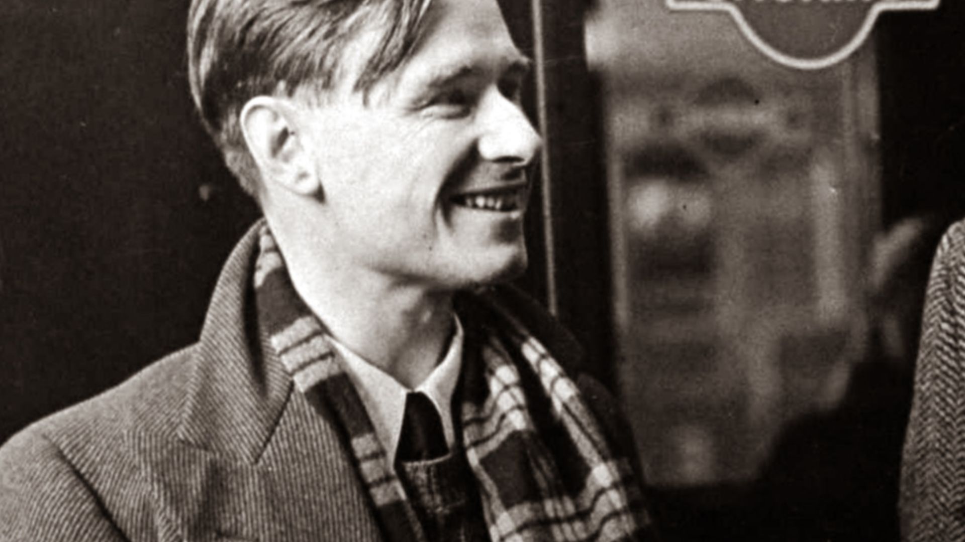 Daily Herald Archive at the National Media Museum. This photograph shows the poet and playwright W.H. Auden (1907-1973), pictured right, and the novelist and playwright Christopher Isherwood (1904-1986) chatting at Victoria Station, London. They were trav