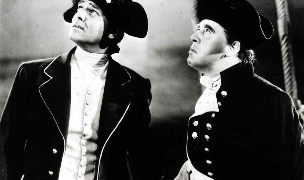 Kino. Meuterei Auf Der Bounty, Mutiny On The Bounty, Meuterei Auf Der Bounty, Mutiny On The Bounty, Clark Gable, Charles Laughton William Bligh (Charles Laughton,r), Kapitaen der Bounty und sein 1. Offizier Fletcher Christian (Clark Gable)., 1962.