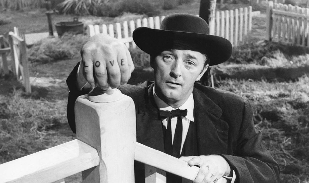 American actor Robert Mitchum on the set of The Night of the Hunter, based on the novel by Davis Grubb and directed by Charles Laughton.